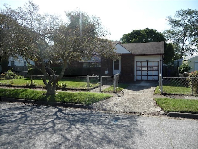 view of front of house with a garage and a front lawn