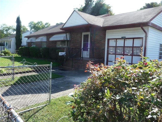 ranch-style house with a front lawn