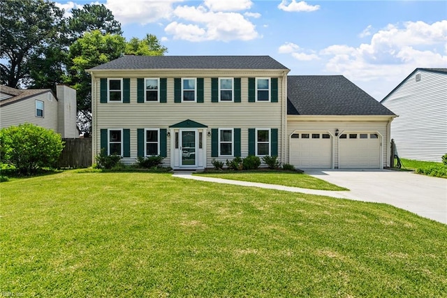 colonial house with a front lawn and a garage