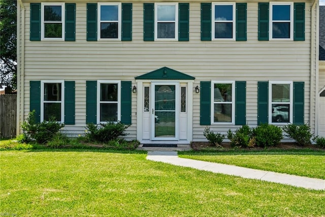 colonial home with a front yard