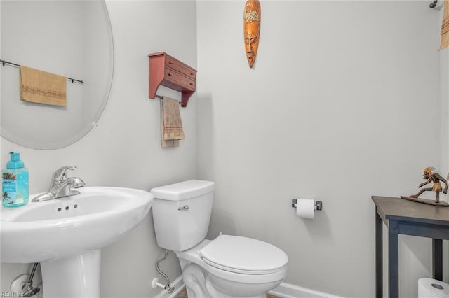 bathroom featuring sink and toilet