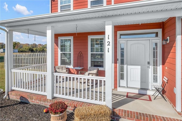 entrance to property featuring a porch