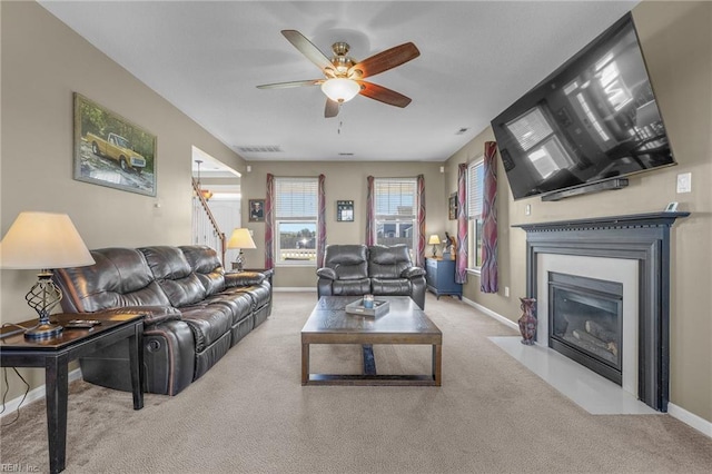 living room with light carpet and ceiling fan