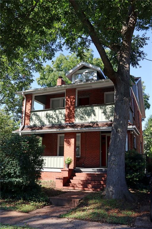 view of front of house with a balcony and a porch