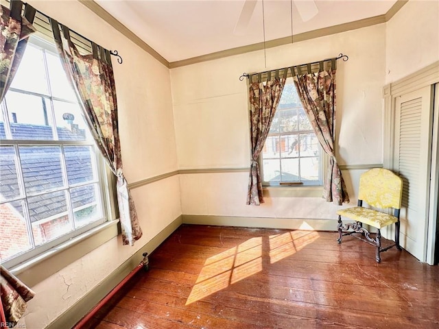 sitting room featuring dark hardwood / wood-style flooring and ornamental molding