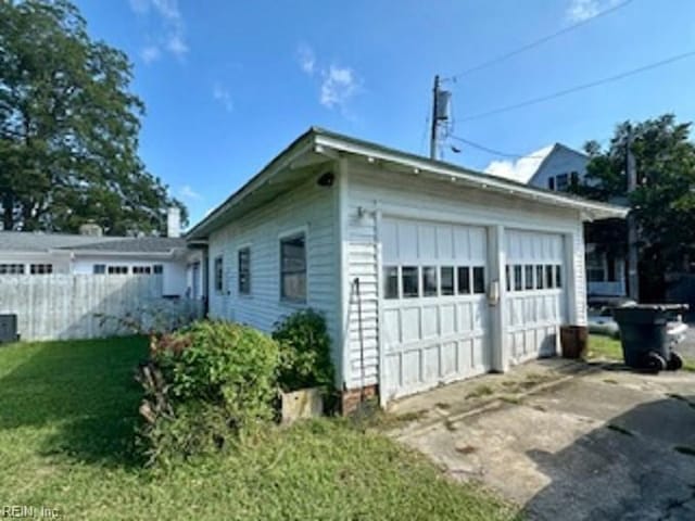 view of property exterior featuring a garage