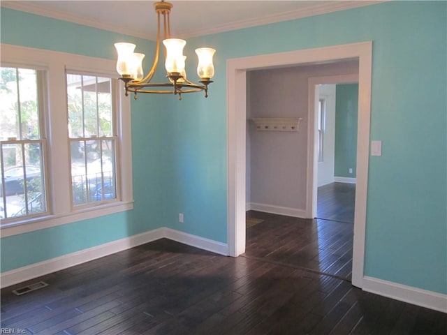 unfurnished dining area with a notable chandelier, crown molding, and dark hardwood / wood-style flooring