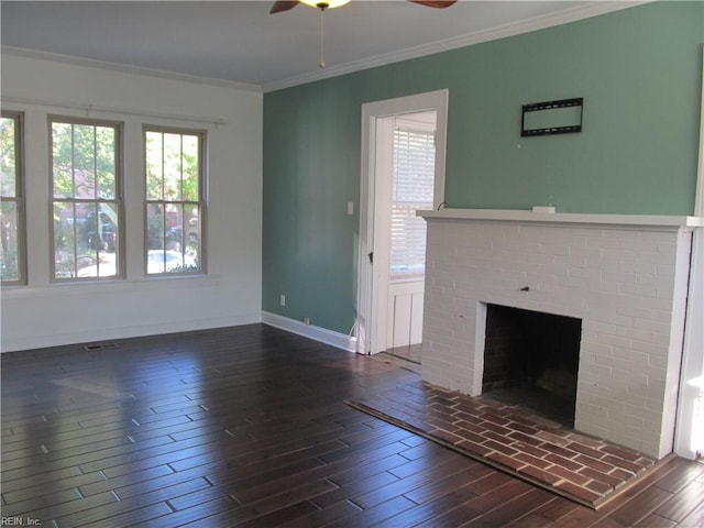 unfurnished living room with ornamental molding, a fireplace, ceiling fan, and dark hardwood / wood-style floors