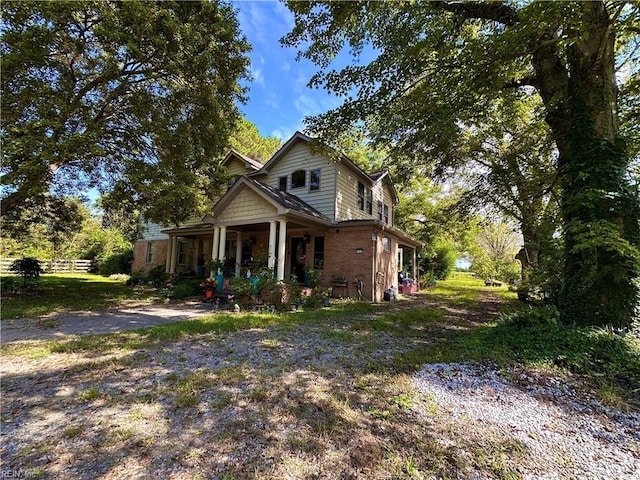 1057 W Rd, Chesapeake, VA 23323 - view of front of house featuring a porch and brick siding