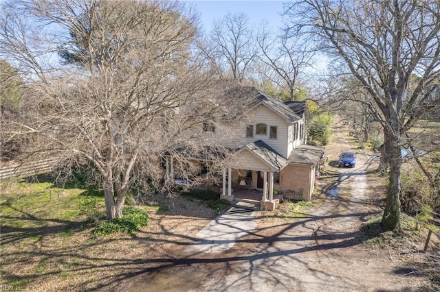 1057 W Rd, Chesapeake, VA 23323 - view of front facade featuring dirt driveway and covered porch