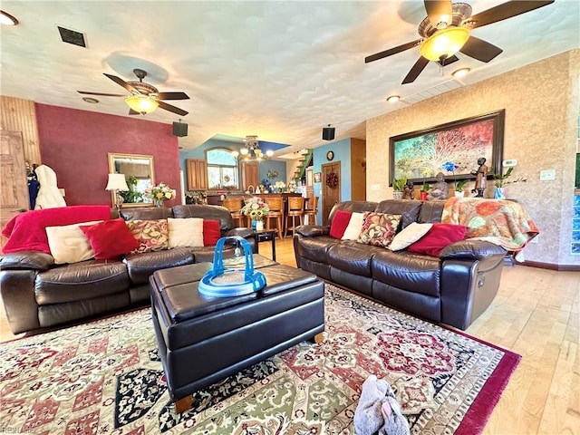 1057 W Rd, Chesapeake, VA 23323 - living room featuring a ceiling fan, hardwood / wood-style floors, a chandelier, and baseboards