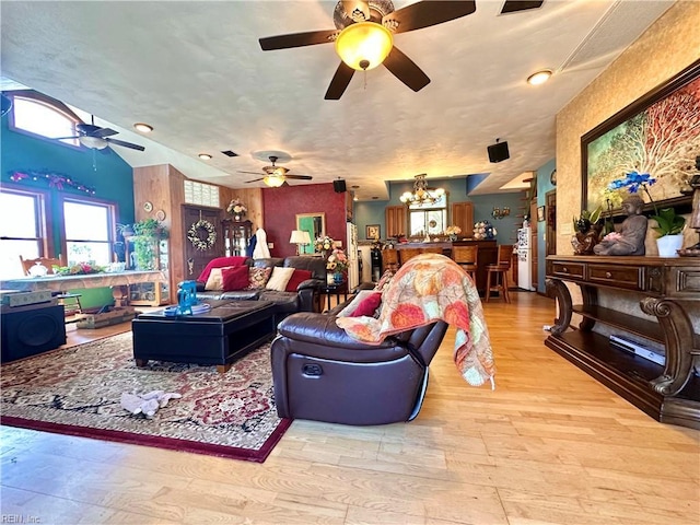 1057 W Rd, Chesapeake, VA 23323 - living area with wood finished floors, ceiling fan, and a chandelier