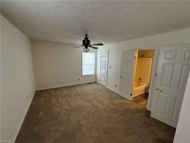 unfurnished room with carpet floors, a textured ceiling, and ceiling fan