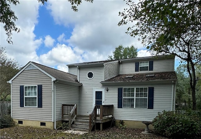 back of property featuring a wooden deck