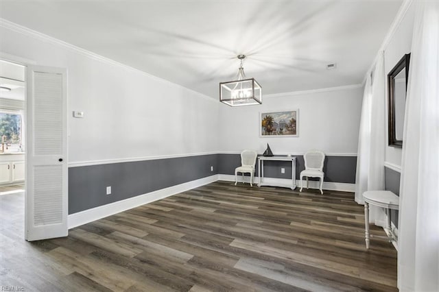 interior space with crown molding, a chandelier, and dark hardwood / wood-style flooring