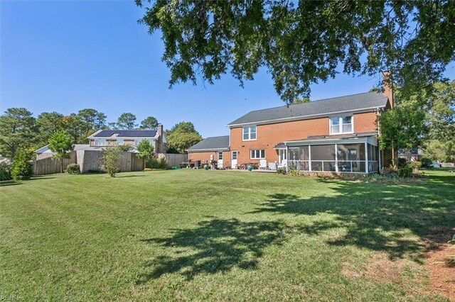 view of yard featuring a sunroom