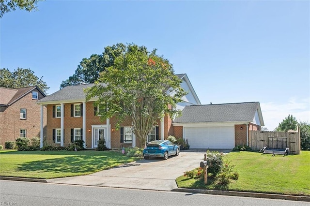 view of front of home featuring a garage and a front lawn