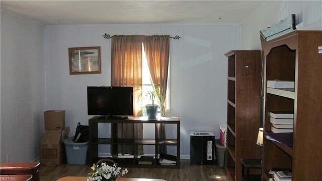 living room featuring wooden walls and dark hardwood / wood-style floors