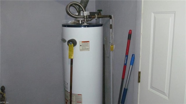 utility room featuring gas water heater