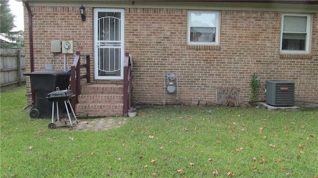 exterior space featuring a lawn and cooling unit