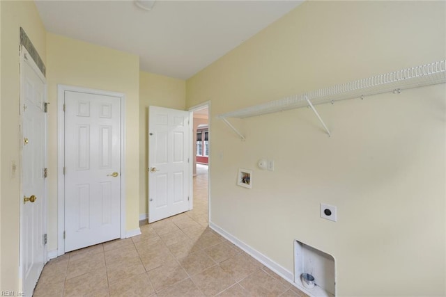 laundry room with hookup for a washing machine, light tile patterned floors, and electric dryer hookup