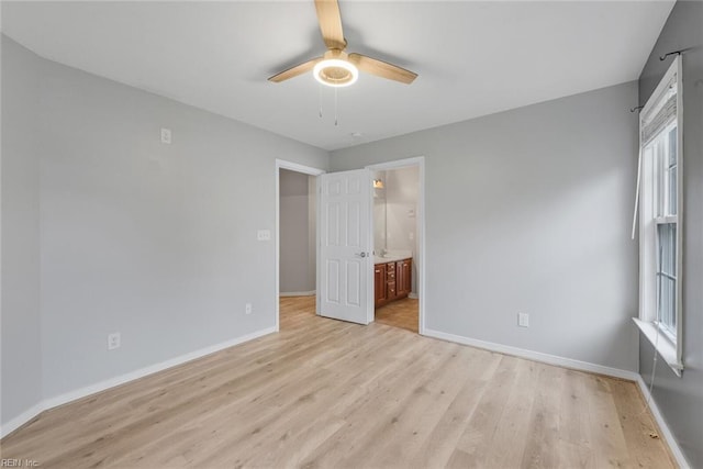 unfurnished bedroom with ceiling fan, light hardwood / wood-style flooring, and ensuite bath