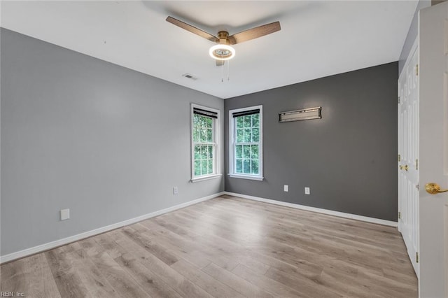 unfurnished room with ceiling fan and light hardwood / wood-style flooring