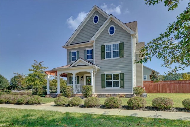 view of front facade with a porch and a front yard