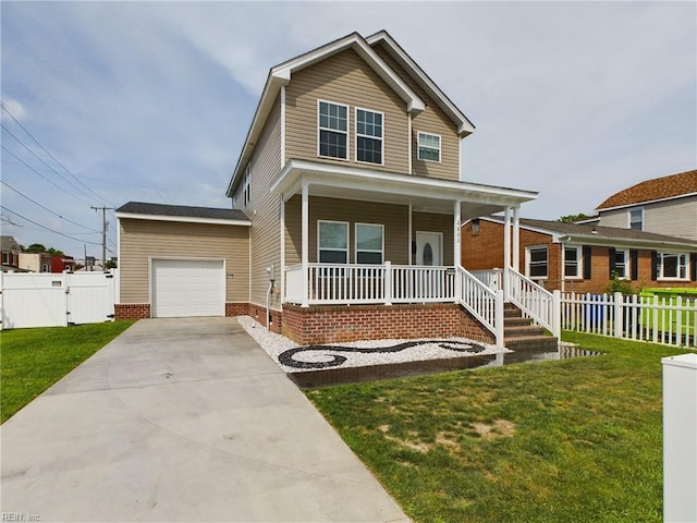 view of front of home featuring a front yard, a garage, and covered porch