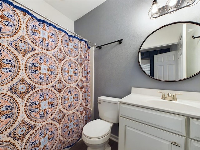 bathroom with vanity, toilet, and a shower with shower curtain