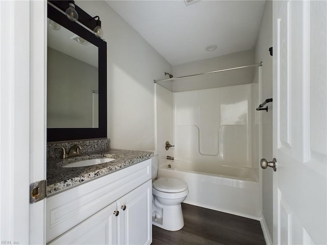 full bathroom featuring shower / tub combination, vanity, toilet, and hardwood / wood-style flooring