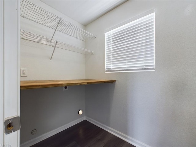 laundry room featuring hookup for an electric dryer and dark hardwood / wood-style floors