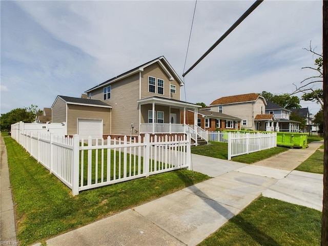 view of front of house featuring a front yard, a garage, and a porch