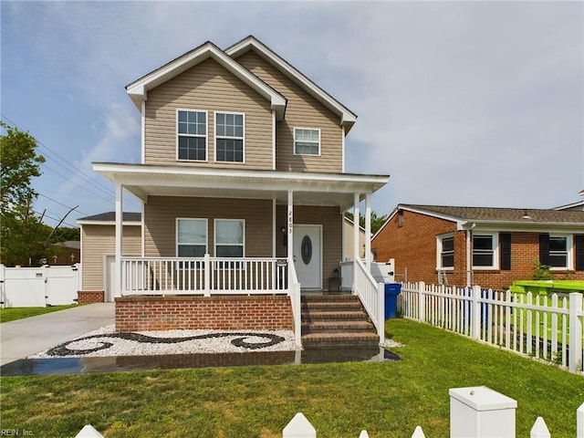 view of front facade with a front lawn and a porch