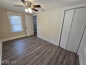 unfurnished bedroom with a closet, ceiling fan, and dark hardwood / wood-style floors