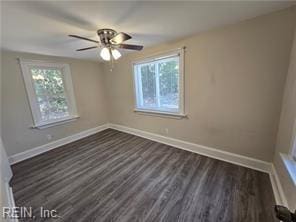 empty room featuring ceiling fan and dark hardwood / wood-style floors