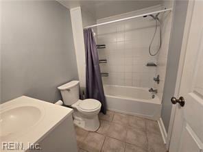 full bathroom with vanity, tile patterned flooring, toilet, and shower / tub combo with curtain