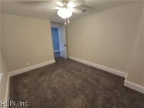 unfurnished bedroom featuring ceiling fan and dark carpet