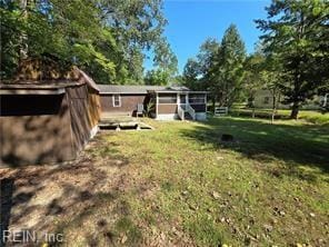 view of yard with a storage shed