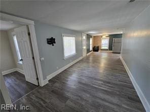 corridor featuring dark hardwood / wood-style flooring and plenty of natural light