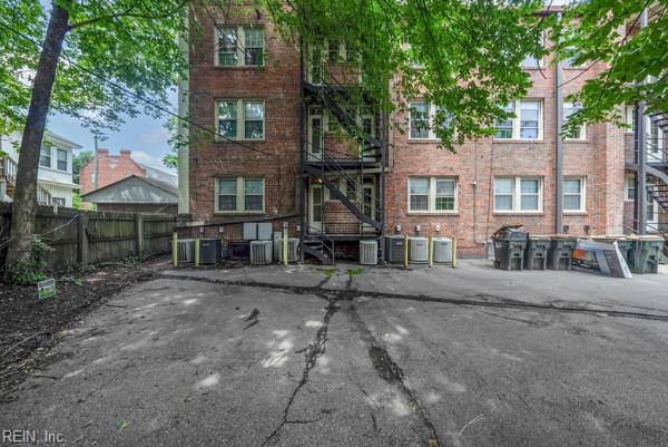 back of property featuring central air condition unit