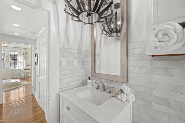 bathroom featuring hardwood / wood-style flooring and vanity