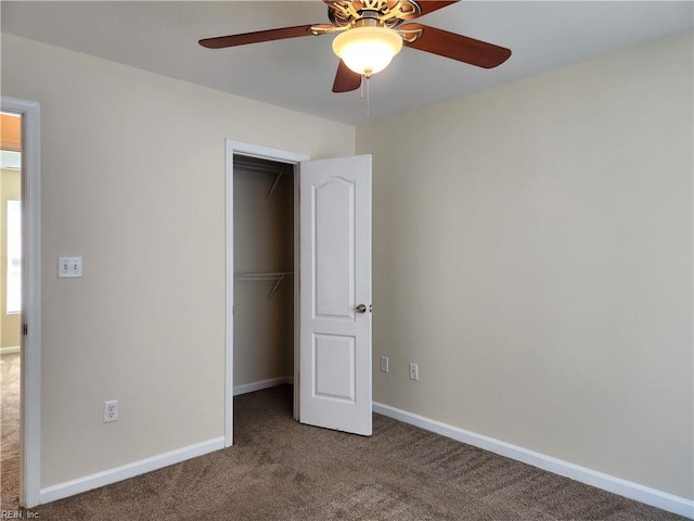 unfurnished bedroom with ceiling fan, carpet floors, and a closet