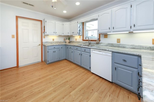 kitchen with light wood-type flooring, crown molding, sink, and dishwasher