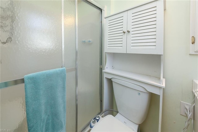 bathroom with walk in shower and toilet