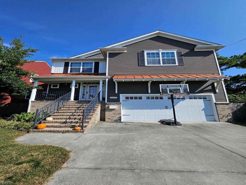 view of front of house with a garage and a porch