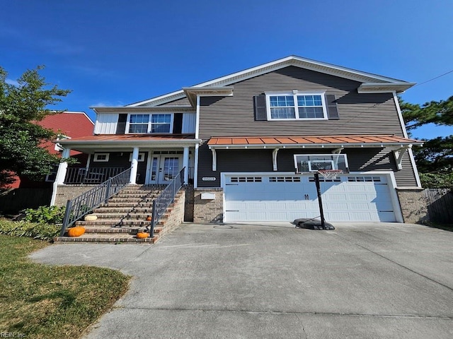 view of front of house with a garage and a porch