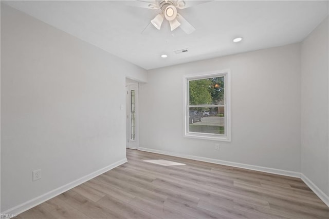 spare room with light hardwood / wood-style floors and ceiling fan