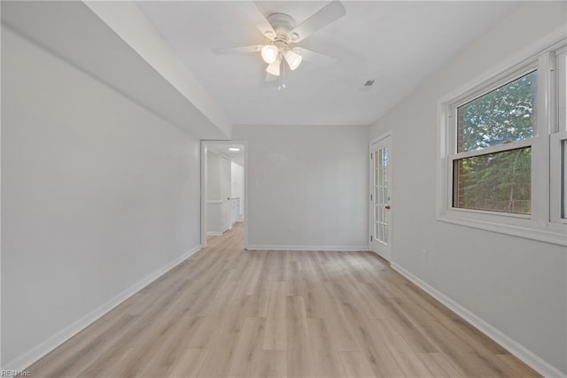 unfurnished room with ceiling fan and light wood-type flooring