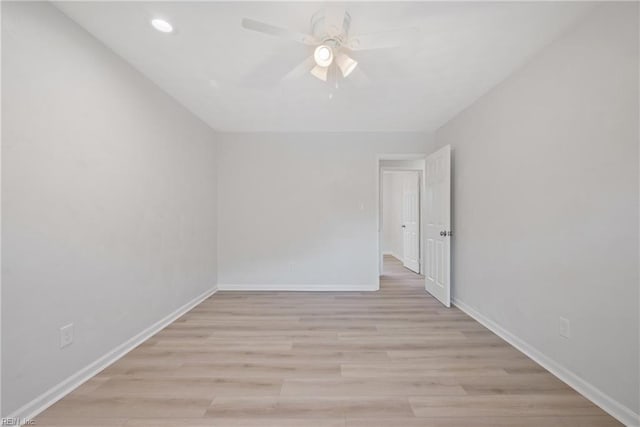 spare room with ceiling fan and light hardwood / wood-style floors